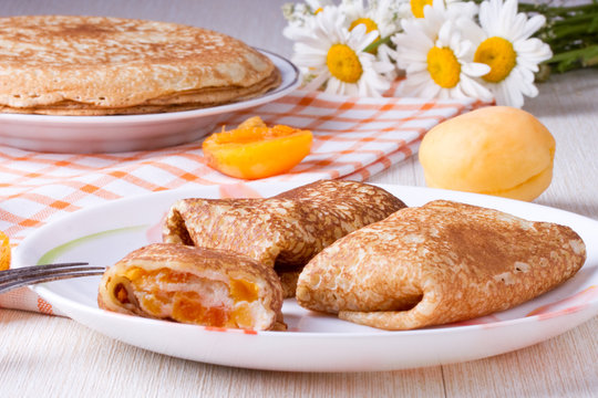Pancakes with curd cheese and dried apricot