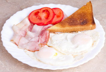 Breakfast of bacon, eggs and toast