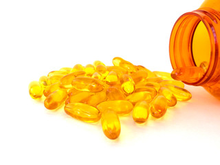 fish oil capsules on white background