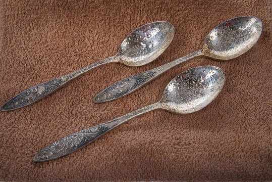 Ancient tablespoons on a soft towel