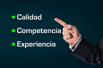 Business man pointing at the words -Quality, Competence, Experie