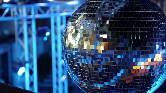 Spinning glitterball on dancefloor