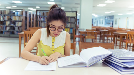 study education, woman writing a paper, working women