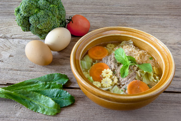 instant noodle in a bowl on a wooden background.