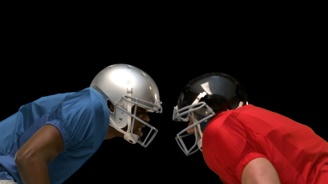 Serious american football player looking at each other 