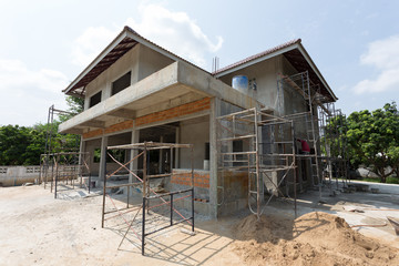 building residential construction house with scaffold steel