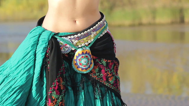 Beautiful  girl dancing exotic dance on beach
