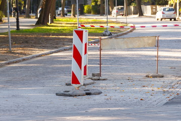 Road sign on city street informing about danger