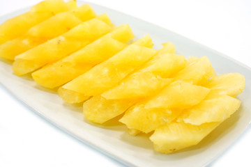 Pineapple slices in a white background.