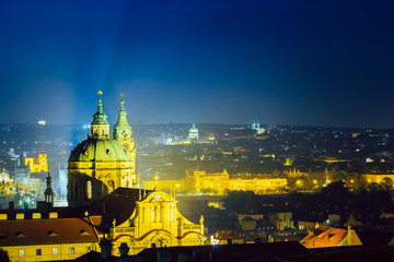 Fototapeta na wymiar Night aerial view of cityscape and St. Nicholas Church in Prague
