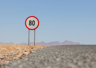 Speed limit sign at a desert road in Namibia