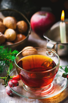 cup of  briar tea on a Christmas rustic  background.
