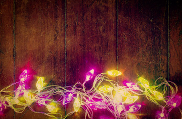 Christmas light on the wooden background