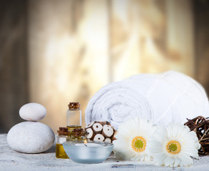 Fototapeta na wymiar Spa concept, still life with aromatic candles and flower