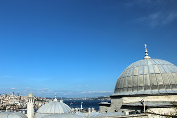 Fototapeta na wymiar View across the domes of the shopping arcade from the Suleymaniye Mosque towards the city of Istanbul