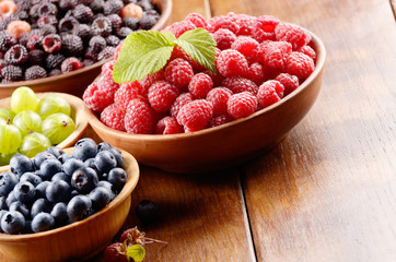 Wooden bowls with organic berries