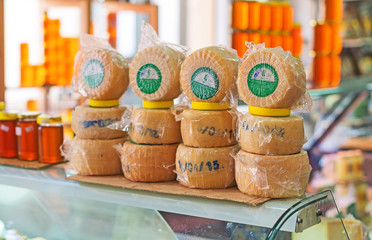 Round cheese products on the market.