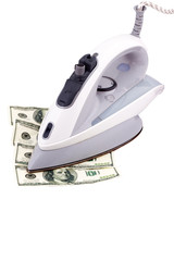 Iron smoothes dollars on a white background