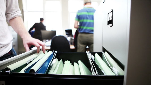 The Office: returning a file to a filing cabinet