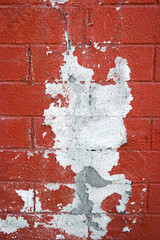 Half painted weathered brick wall