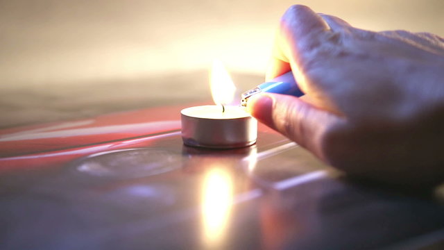 lighting a candle in a abstract background