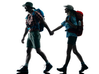Fototapeta na wymiar couple trekker trekking walking nature silhouette