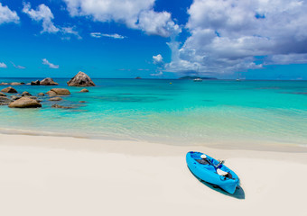 Fototapeta na wymiar Boat at paradise beach on tropical island
