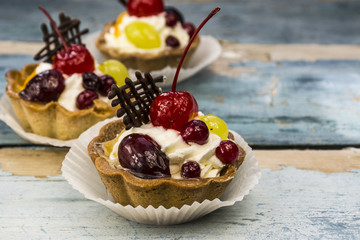 fruit basket cake on an old wooden board