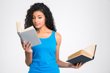 Beautiful afro american woman holding two books