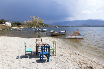 Characteristic restaurant table and chair on coast of the lake