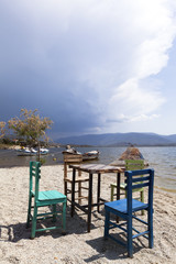 Characteristic restaurant table and chair on coast of the lake