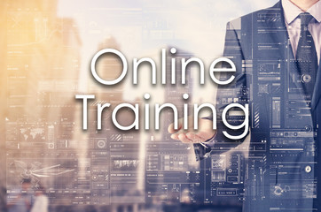 Businessman showing text by his hand: Online Training