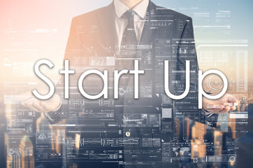 Businessman is presenting text:Start up