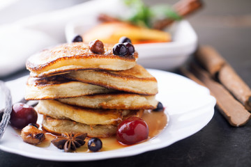 Pancakes with honey, hazelnuts and currants