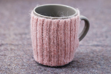 Knitted handmade decoration for a cup