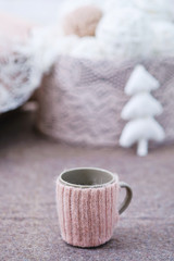 Knitted handmade decoration for a cup