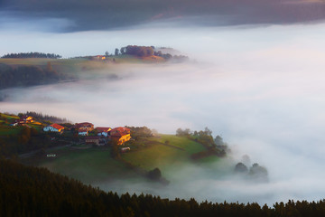 Fototapeta premium Arexola village in Aramaio foggy valley