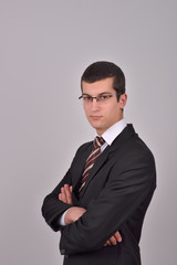 Portrait of young business man with arms crossed