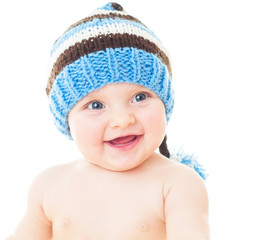 cheerful baby in the blue hat. Beautiful happy baby . One,isolat