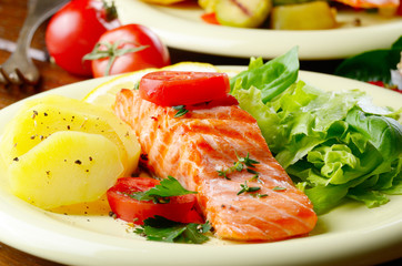 Fried salmon fillet with vegetables