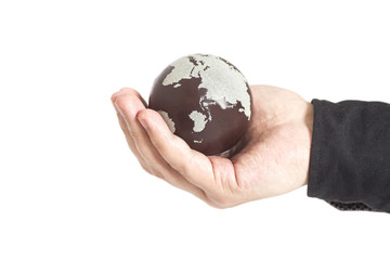 Hand holding Earth isolated on white
