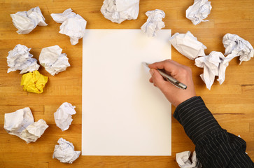 new ideas - Hand with white Paper on the working desk