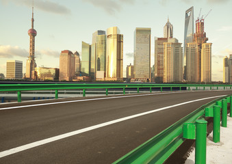 Empty road surface with shanghai bund city buildings