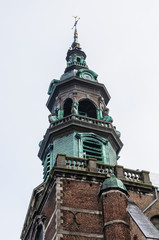 Fototapeta na wymiar Church tower in Mons, Belgium, the Capital of Culture
