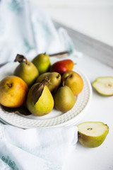 Autumn pears on white pastel background