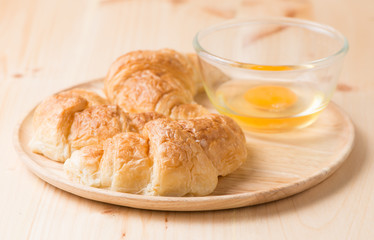 croissant  on wooden plate