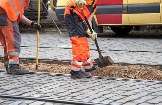 Workers repair tram ways