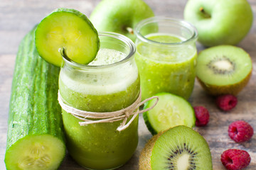 Fototapeta na wymiar Green smoothie with cucumber,kiwi and apples