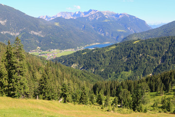 Fototapeta na wymiar Landscape view of the Achensee (Lake Achen) surrounded by mountains and forests in Tirol, Austria
