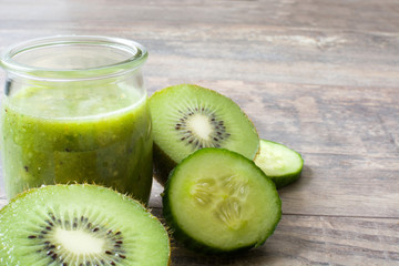 Fototapeta na wymiar Green smoothie with cucumber,kiwi and apples